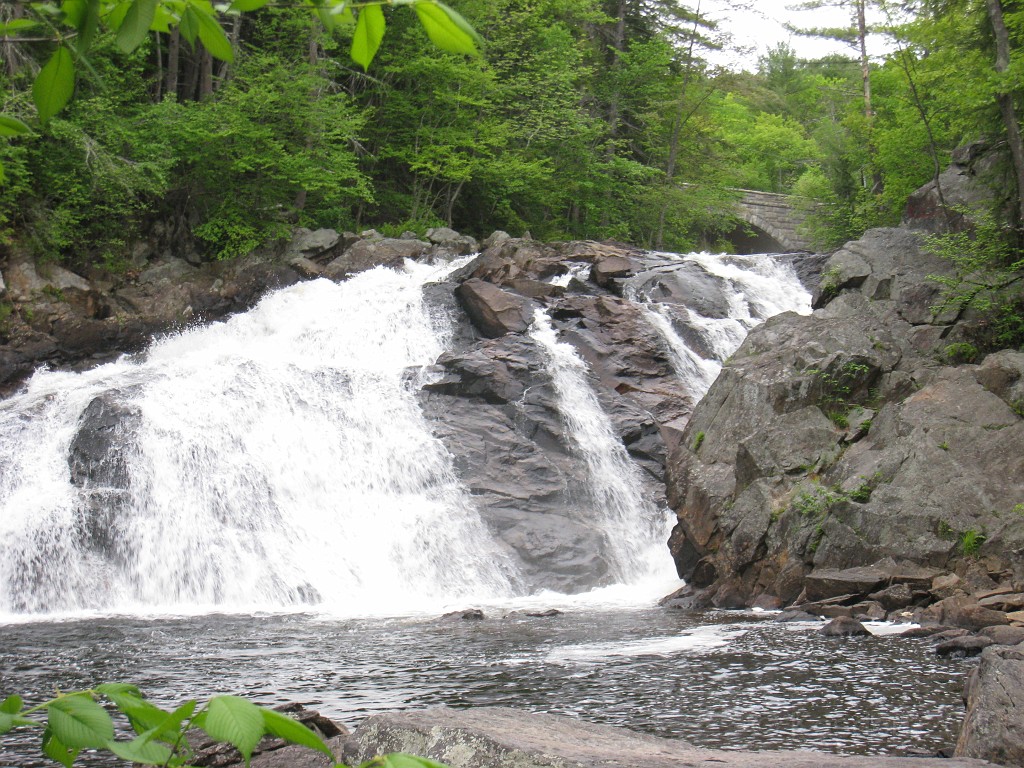 Old Hill Village - South End 560.jpg - In February 1937, residents of Hill Village NH learned that their village, near the Pemigewasset River, was to become a flood control reservoir for the Franklin Falls dam project. To accommodate the construction of the Franklin Falls Dam, the village of Hill NH was to be relocated. By January of 1940, the citizens of Hill NH formed an association, purchased land, and began planning a new model village with the help of the NH State Planning and Development Commission. Construction started in 1940, and by June of 1941 the new town hall and school were completed, along with the streets, water system, and 30 houses. The 1941 town meeting was called to order in the old town hall, recessed, and reconvened in the new village.